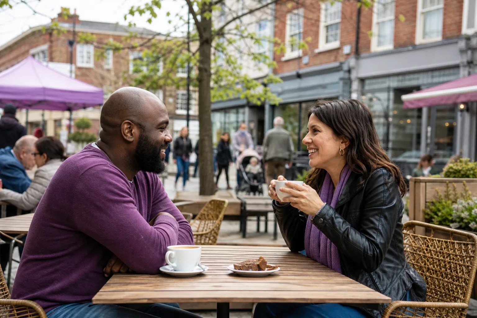 Two people talking over coffee in Aylesbury town centre