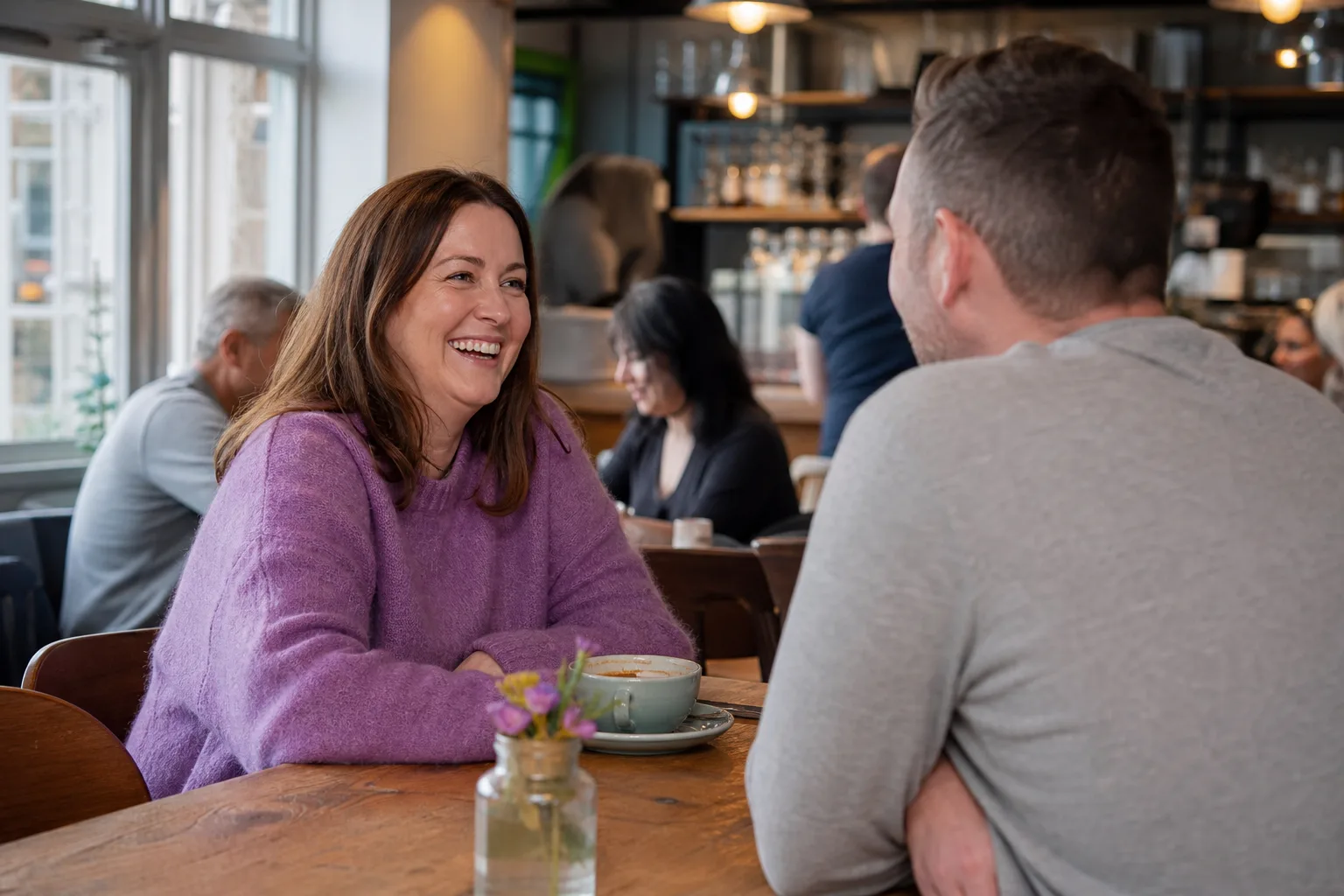 Adults chatting at a relaxed social event in Aylesbury
